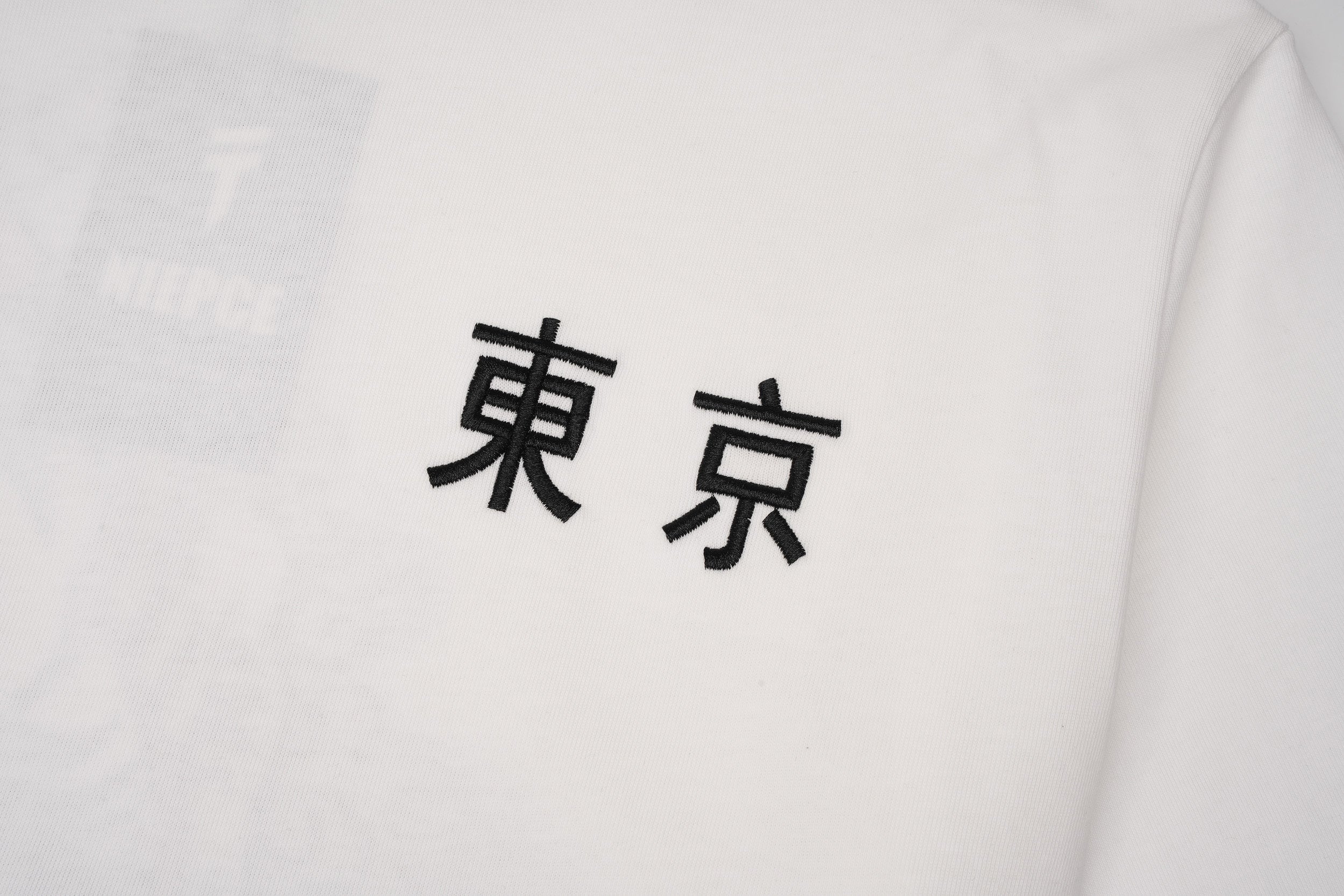 ET9977 War of Beasts Embroidered Tee